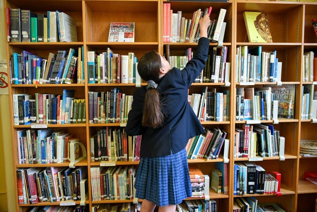 Reading on digital devices does little to improve reading, study suggests (Ben Birchall/PA)