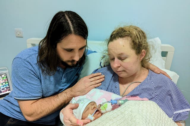 <p>Robert Miller and Katie Fowler saying goodbye to their daughter Abigail </p>