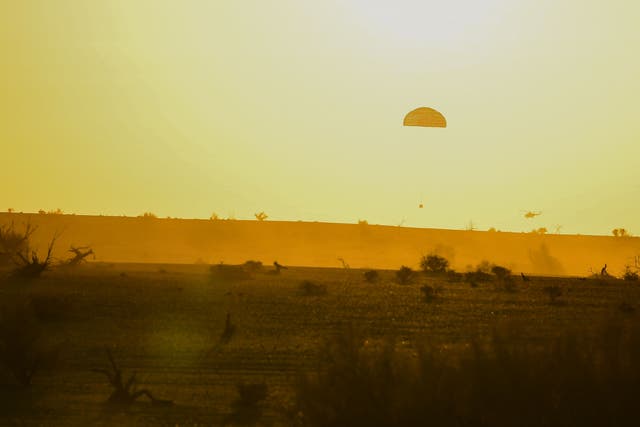 <p>The capsule of the Shenzhou-16 spaceship carrying three astronauts prepares to land in China’s Inner Mongolia on October 31, 2023</p>