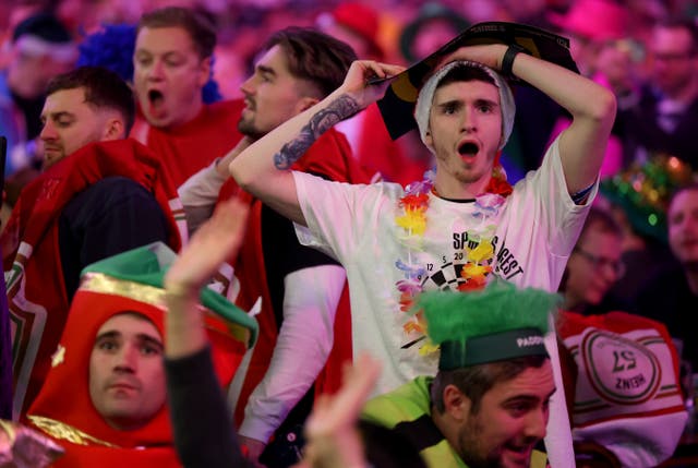 <p>Fans at the opening night of the World Darts Championship </p>