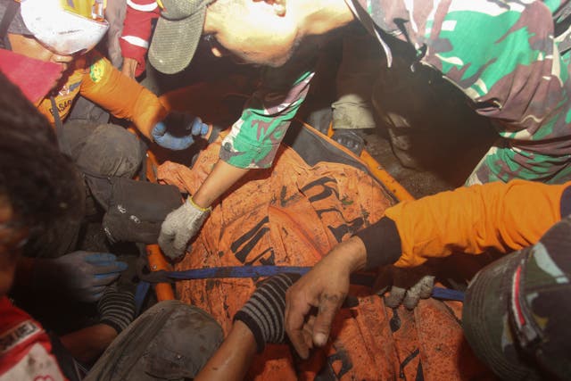 <p>Rescuers carry the body of a hiker killed in the eruption of Mount Marapi in Agam, West Sumatra, Indonesia, Wednesday</p>