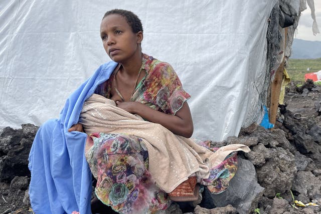 <p>Sifa* breastfeeding her young baby in the Mugunga camp in the Democratic Republic of Congo</p>