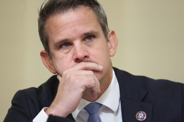 <p> Rep. Adam Kinzinger (R-IL) watches as a video showing scenes of the January 6th attack is played before the House Select Committee investigating the January 6 attack on US Capitol on July 27, 2021 at the U.S. Capitol in Washington, DC</p>