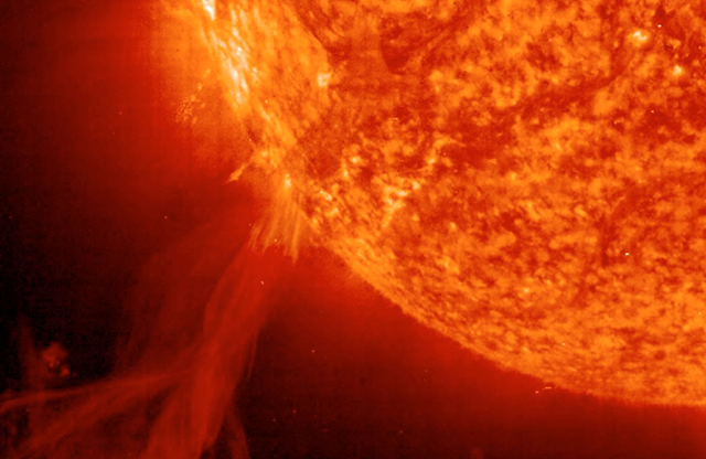 <p>Astronomers at the Solar & Heliospheric Observatory (SOHO) captured this image of a solar prominence erupting from the surface of the Sun on October 25, 2002. </p>