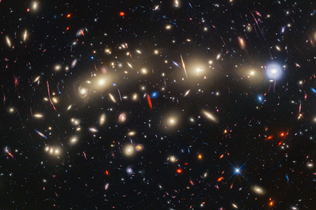 <p>This panchromatic view of galaxy cluster MACS0416 was created by combining infrared observations from NASA’s James Webb Space Telescope with visible-light data from NASA’s Hubble Space Telescope</p>